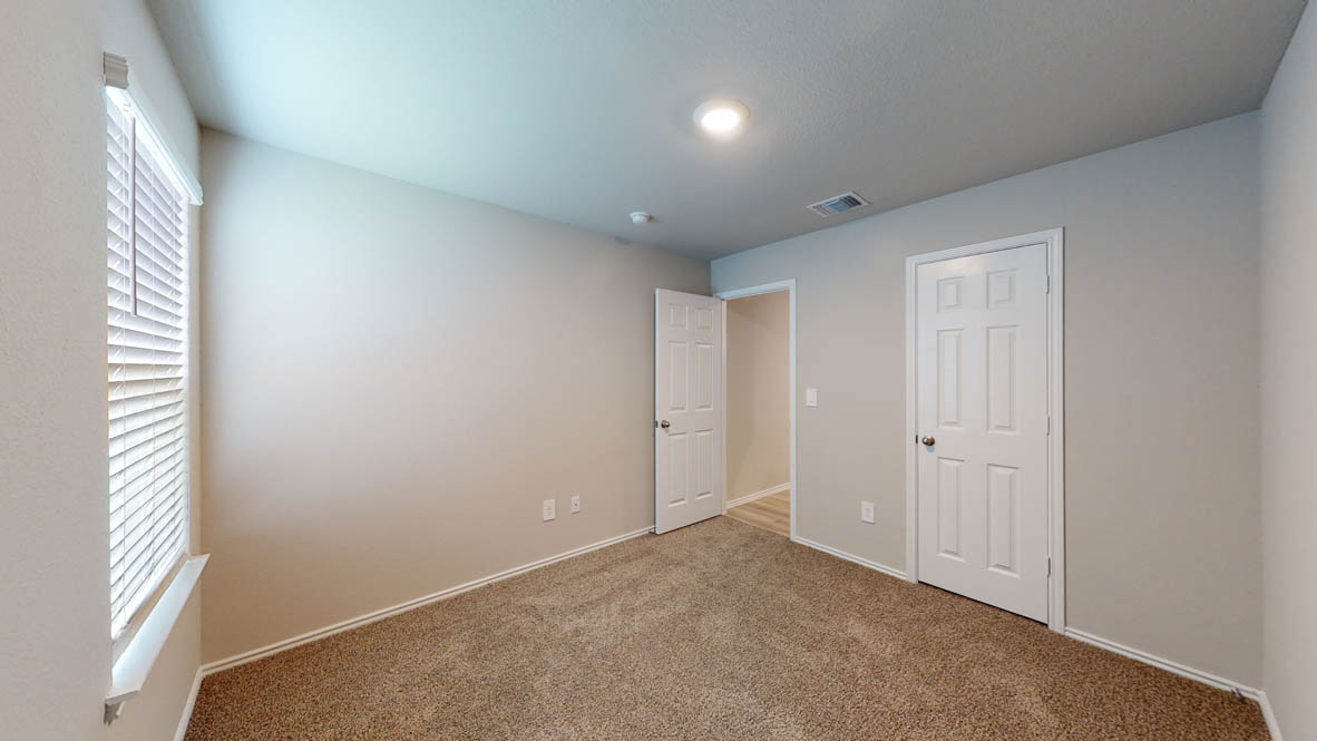 561 Hector Loop Georgetown, TX 78626 - Photo 23 of 30 an empty room with windows
