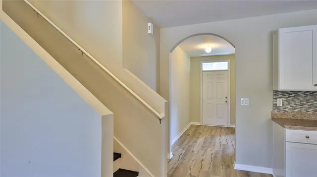 a view of entryway with wooden floor
