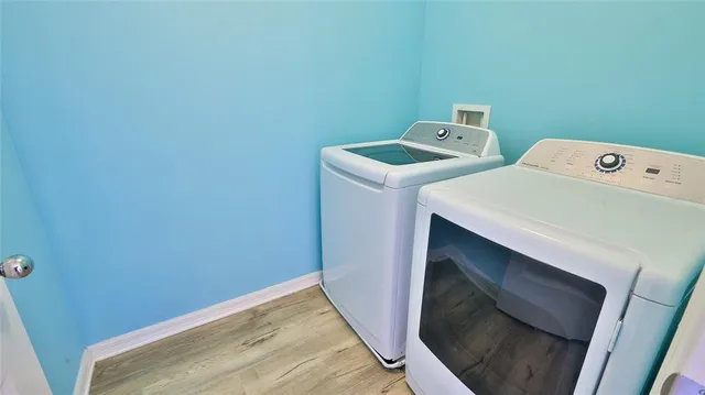 a view of a hallway and wooden floor