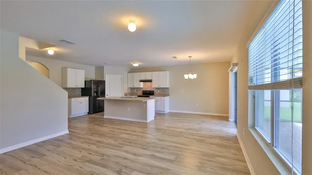 a view of kitchen with wooden floor