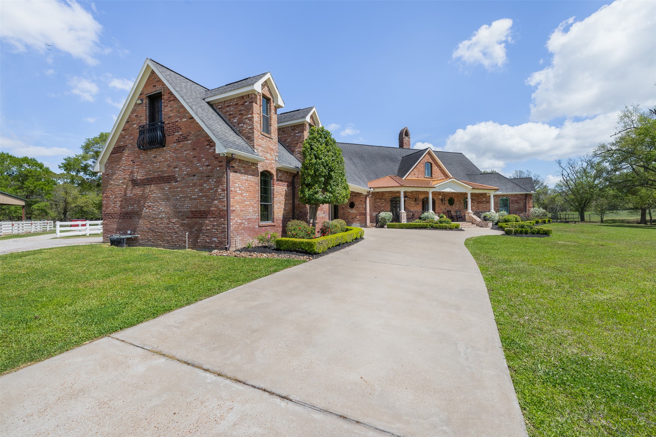 29500 Skymac Ranch Road Hempstead, TX 77445 - Photo 4 of 50 a front view of a house with a yard table and garage