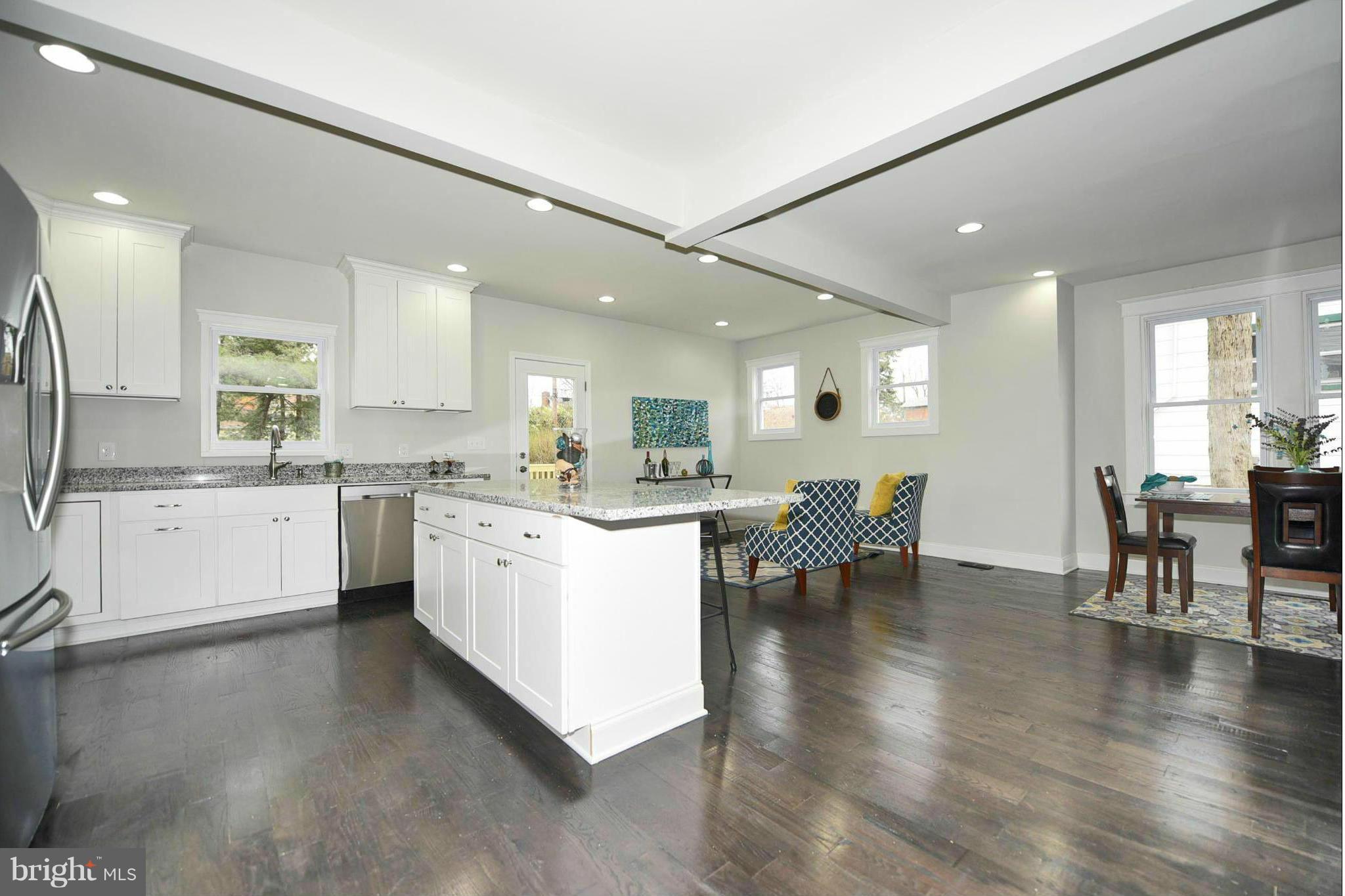 809 Cedarcroft Road Baltimore, MD 21212 - Photo 11 of 26 a open kitchen with white cabinets and stainless steel appliances