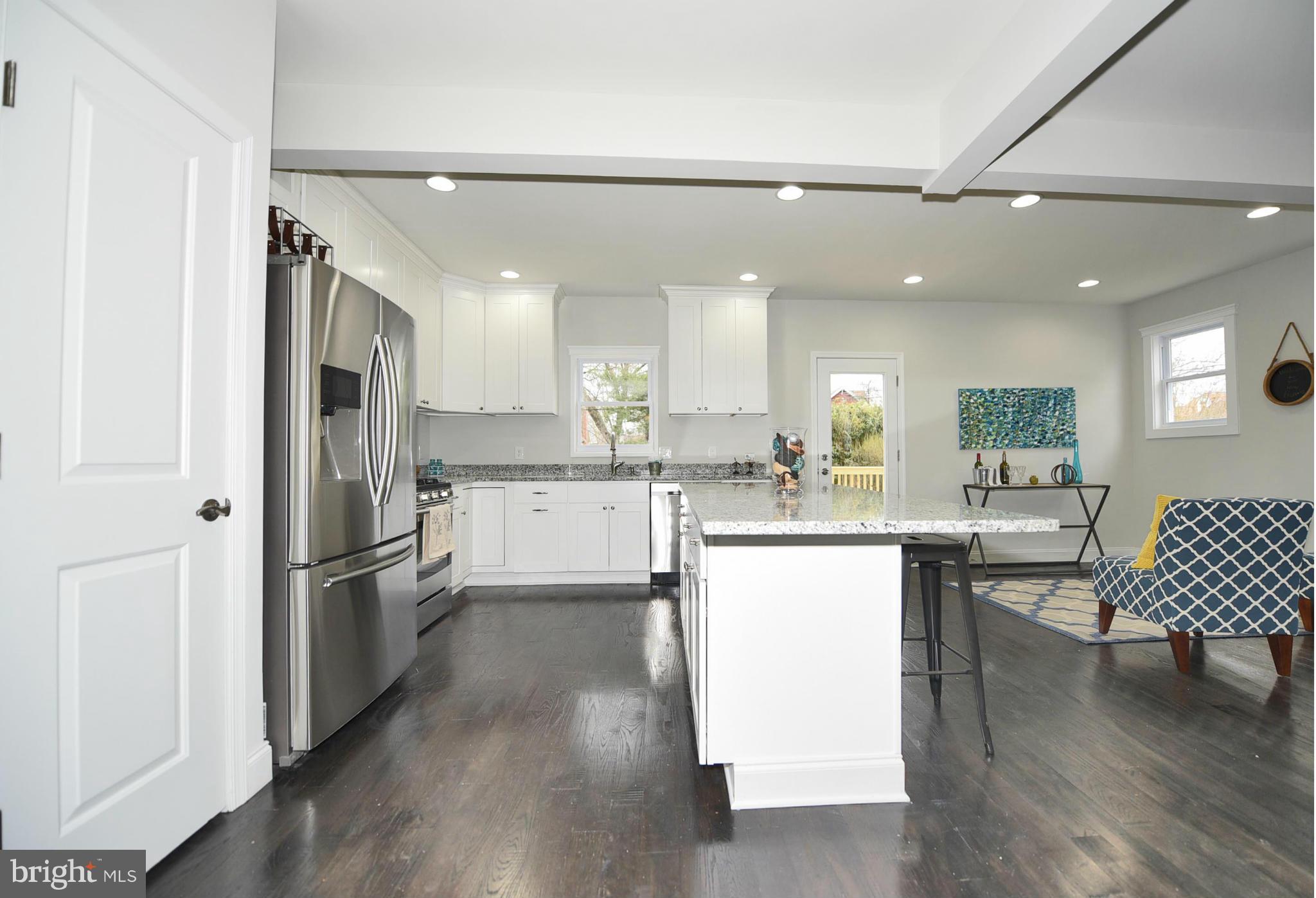 809 Cedarcroft Road Baltimore, MD 21212 - Photo 12 of 26 a kitchen with a sink stainless steel appliances and cabinets