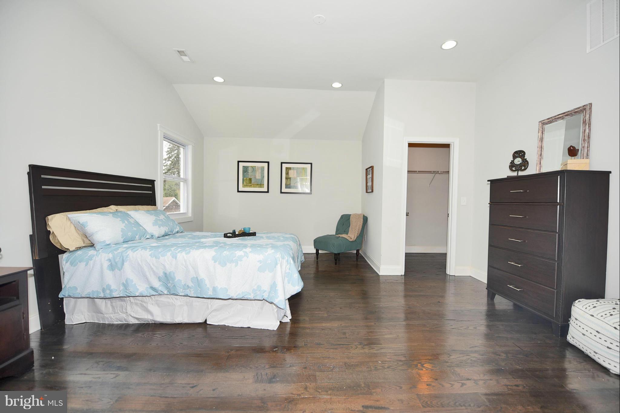 809 Cedarcroft Road Baltimore, MD 21212 - Photo 18 of 26 a bedroom with a bed and a dresser