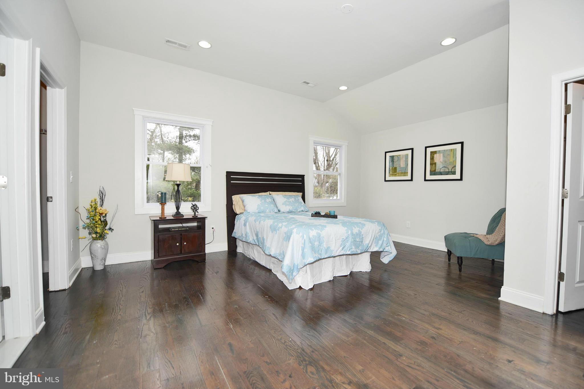 809 Cedarcroft Road Baltimore, MD 21212 - Photo 19 of 26 a bedroom with a bed and furniture