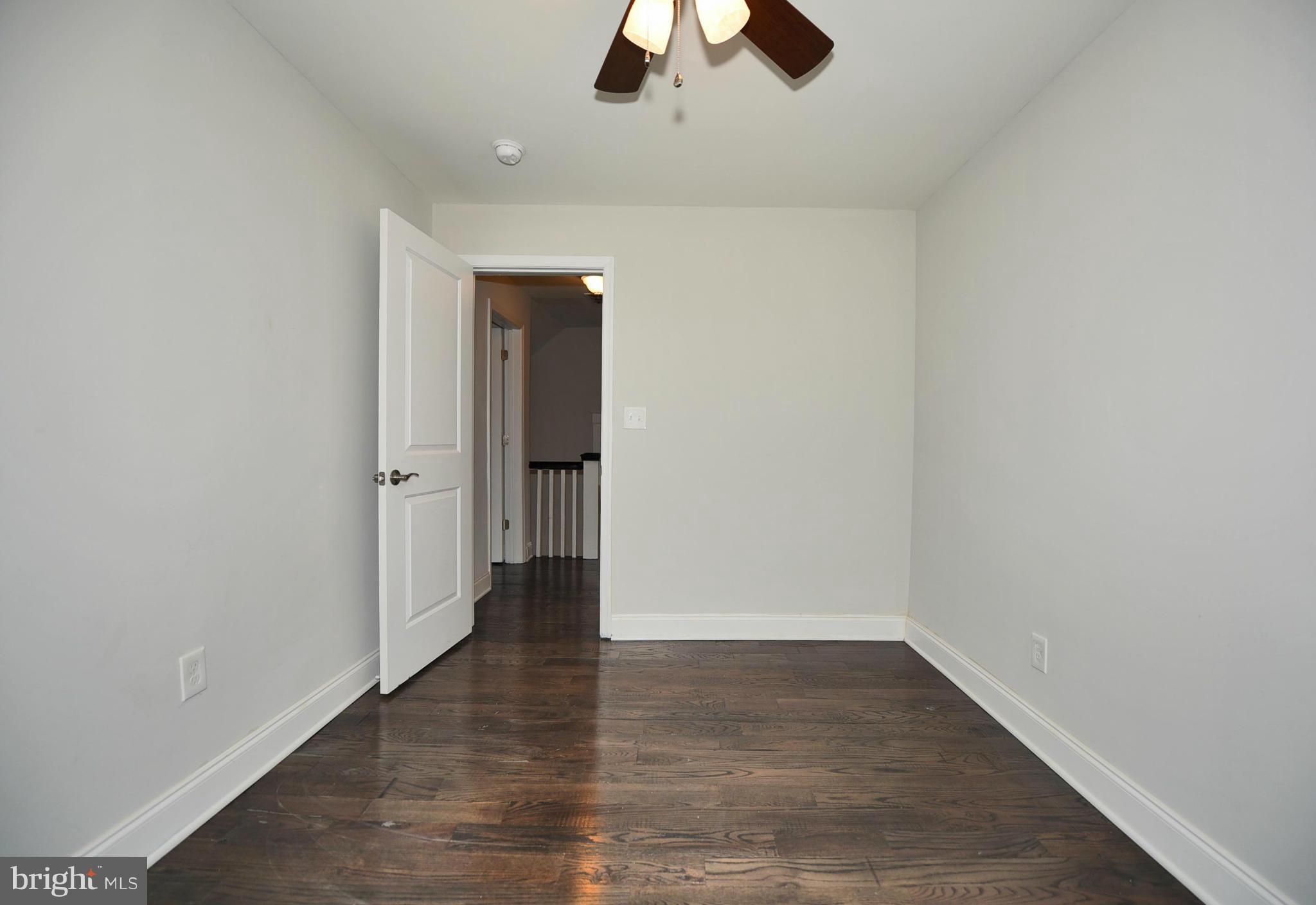 809 Cedarcroft Road Baltimore, MD 21212 - Photo 21 of 26 wooden floor in an empty room