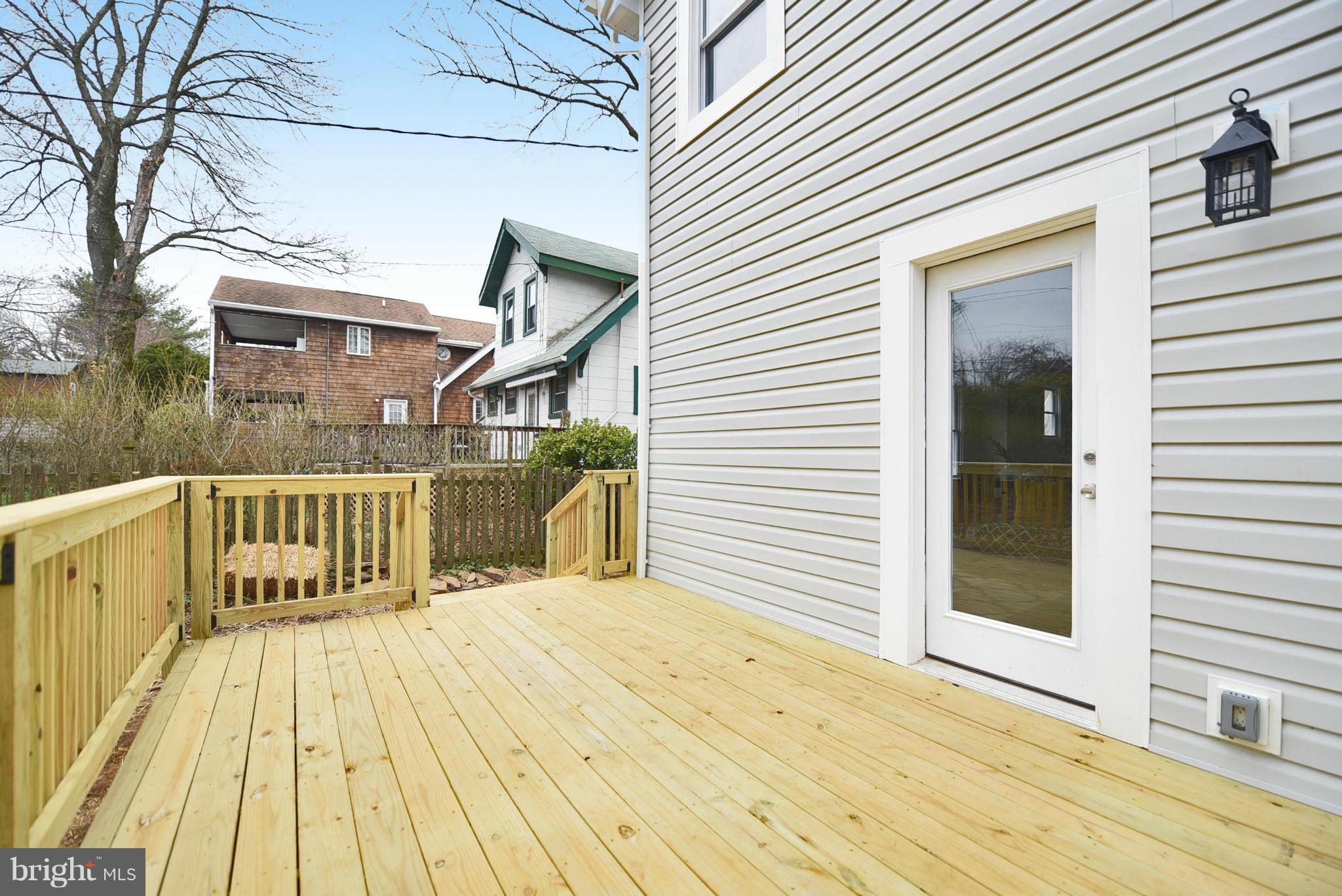 809 Cedarcroft Road Baltimore, MD 21212 - Photo 25 of 26 a view of a house with wooden deck
