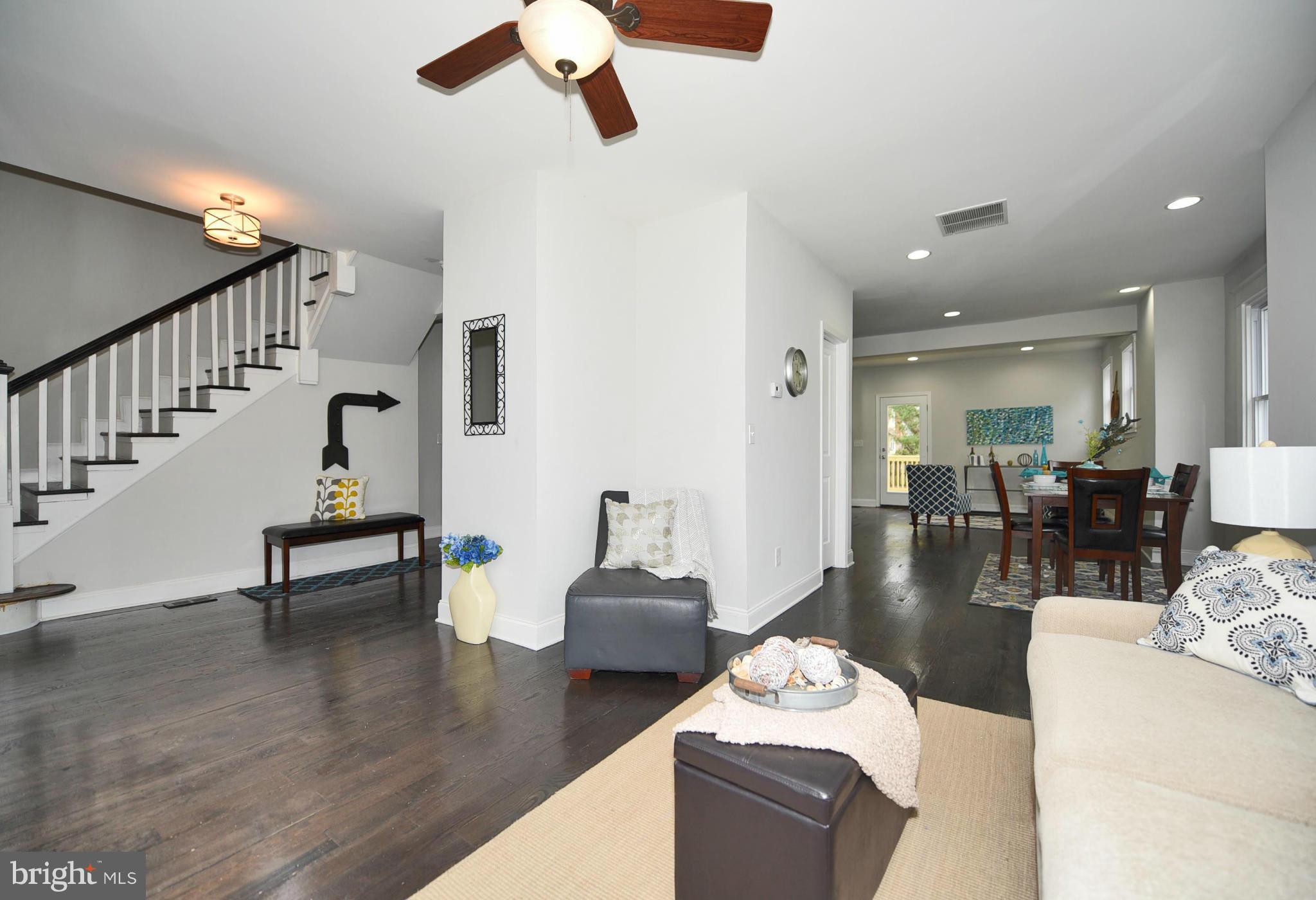 809 Cedarcroft Road Baltimore, MD 21212 - Photo 6 of 26 a living room with furniture and wooden floor