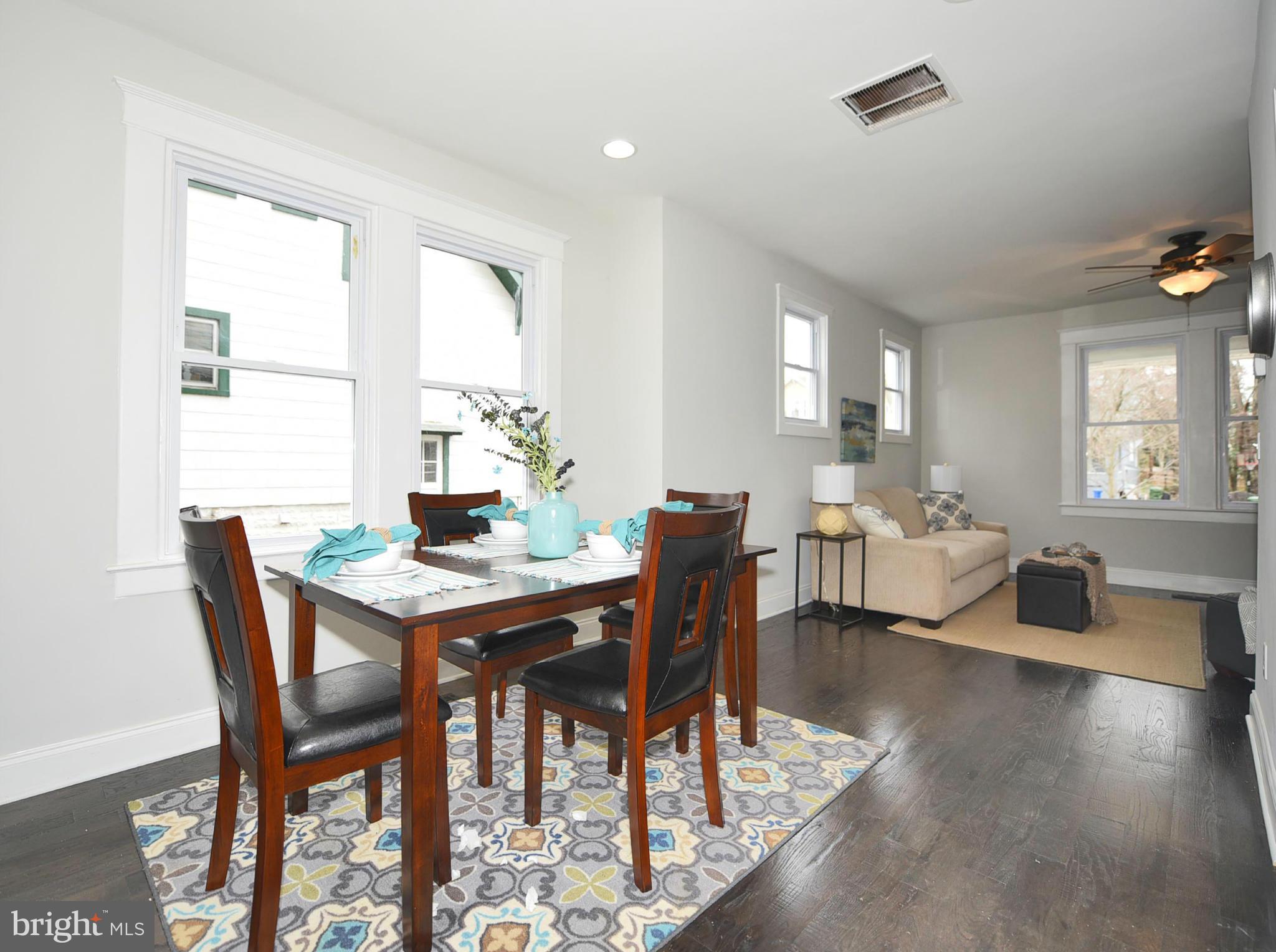 809 Cedarcroft Road Baltimore, MD 21212 - Photo 10 of 26 a view of a dining room with furniture window and wooden floor