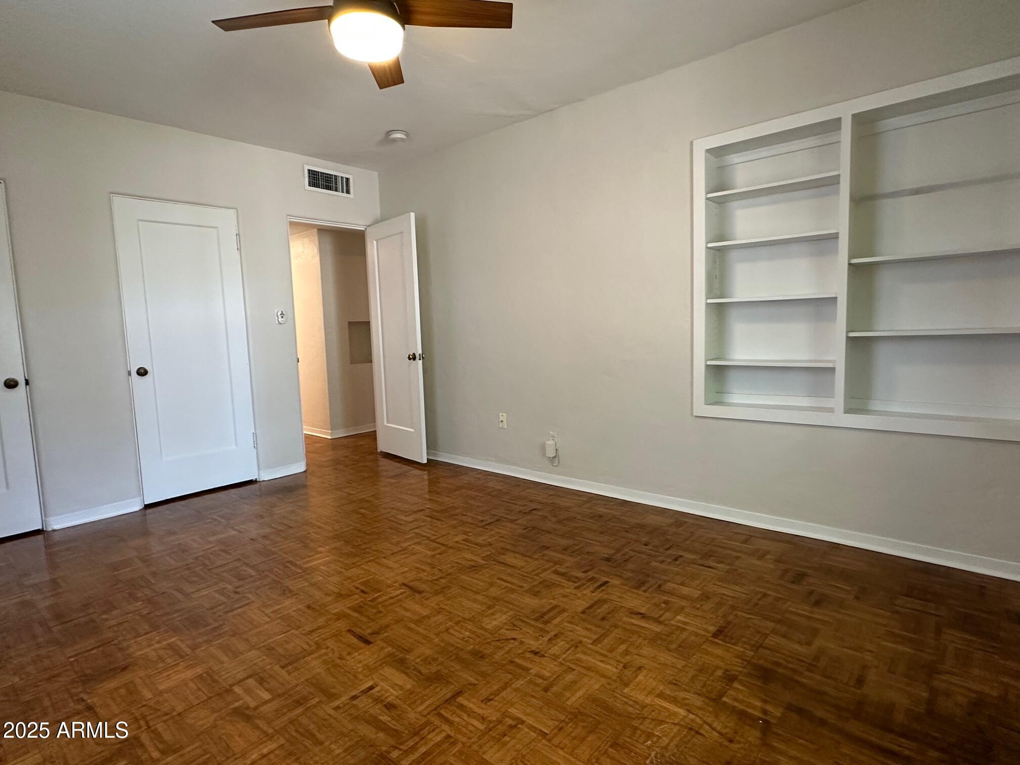 1315 West Holly Street Phoenix, AZ 85007 - Photo 6 of 24 a view of an empty room with a window