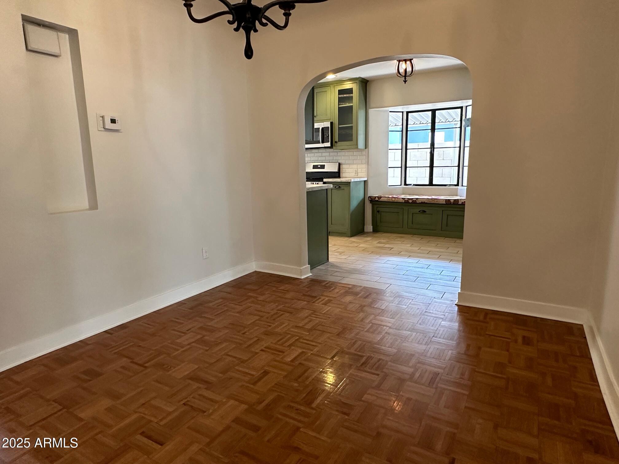 1315 West Holly Street Phoenix, AZ 85007 - Photo 7 of 24 wooden floor in an empty room