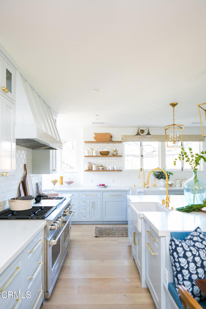 233 Hillside Road South Pasadena, CA 91030 - Photo 24 of 64 a kitchen with stainless steel appliances kitchen island granite countertop a sink and cabinets