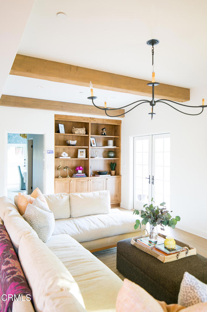 233 Hillside Road South Pasadena, CA 91030 - Photo 53 of 64 a living room with furniture and a chandelier