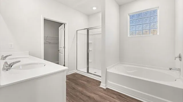 a bathroom with a bathtub and a sink
