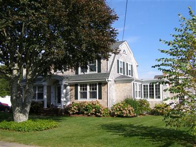 front view of a house with a yard