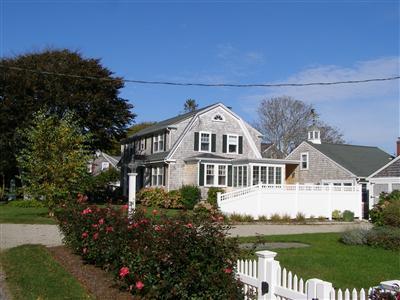 Undisclosed Address Harwich Port, MA 02646 - Photo 2 of 7 a front view of a house with a garden