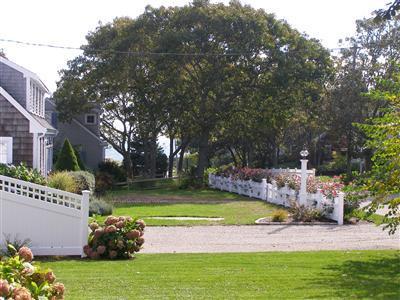 Undisclosed Address Harwich Port, MA 02646 - Photo 3 of 7 a view of a backyard with garden and swimming pool