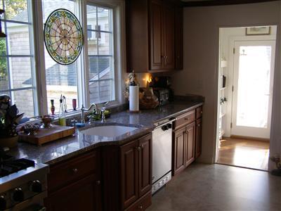 Undisclosed Address Harwich Port, MA 02646 - Photo 5 of 7 a kitchen with a sink and a stove