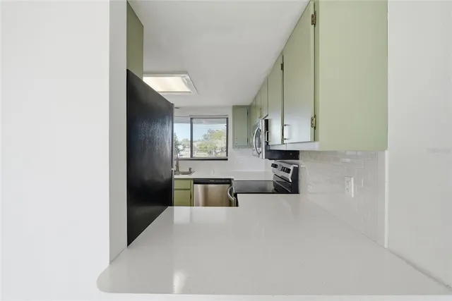 a view of a living room with windows