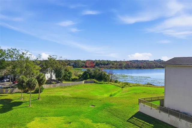 a view of a lake with a yard