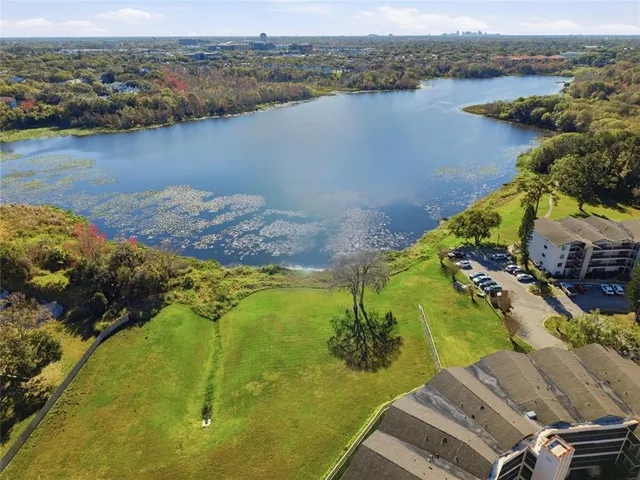 an aerial view of a house with a lake view
