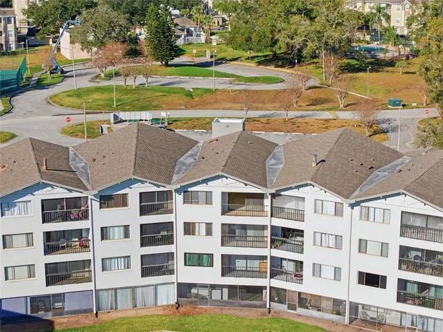 a view of a city with tall buildings and ocean view
