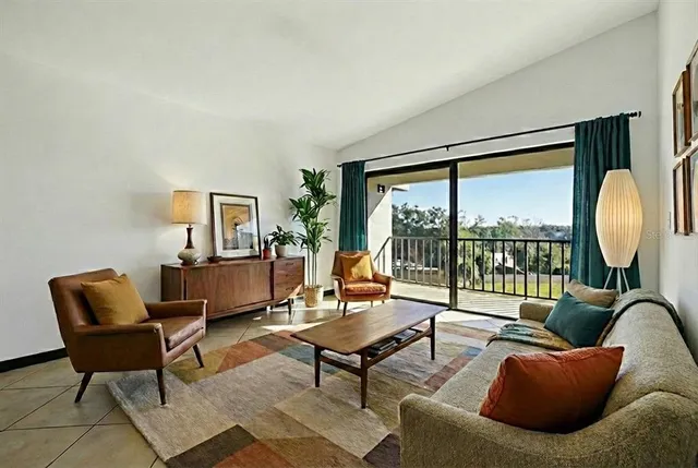 a living room with furniture and a large window