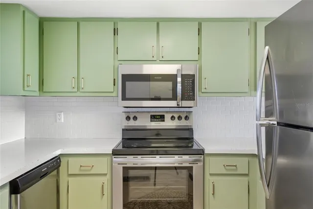 a kitchen with a stove and a microwave
