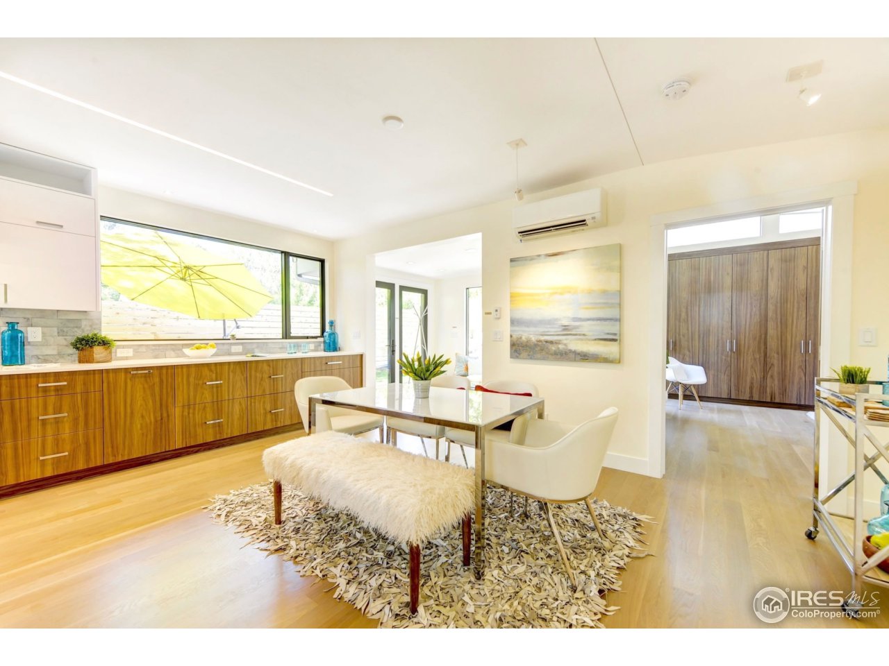 2725 6th Street Boulder, CO 80304 - Photo 11 of 40 a living room with a large window and a table