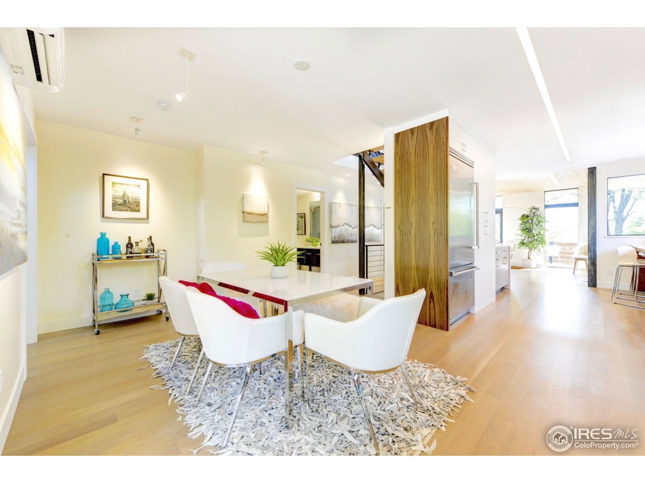 2725 6th Street Boulder, CO 80304 - Photo 12 of 40 a living room with furniture and a dining table with wooden floor