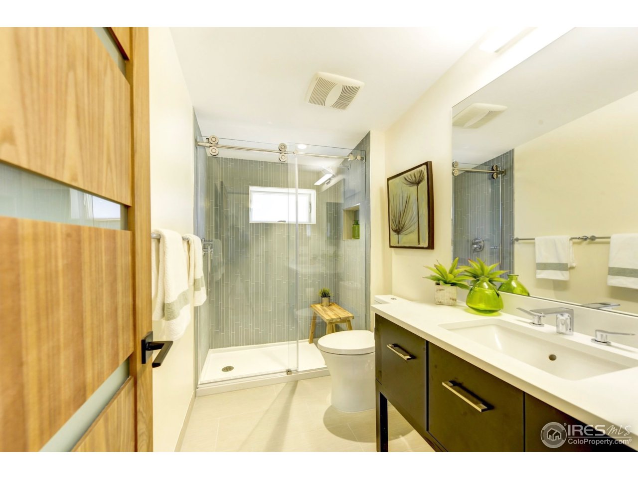 2725 6th Street Boulder, CO 80304 - Photo 14 of 40 a bathroom with a double vanity sink toilet and shower