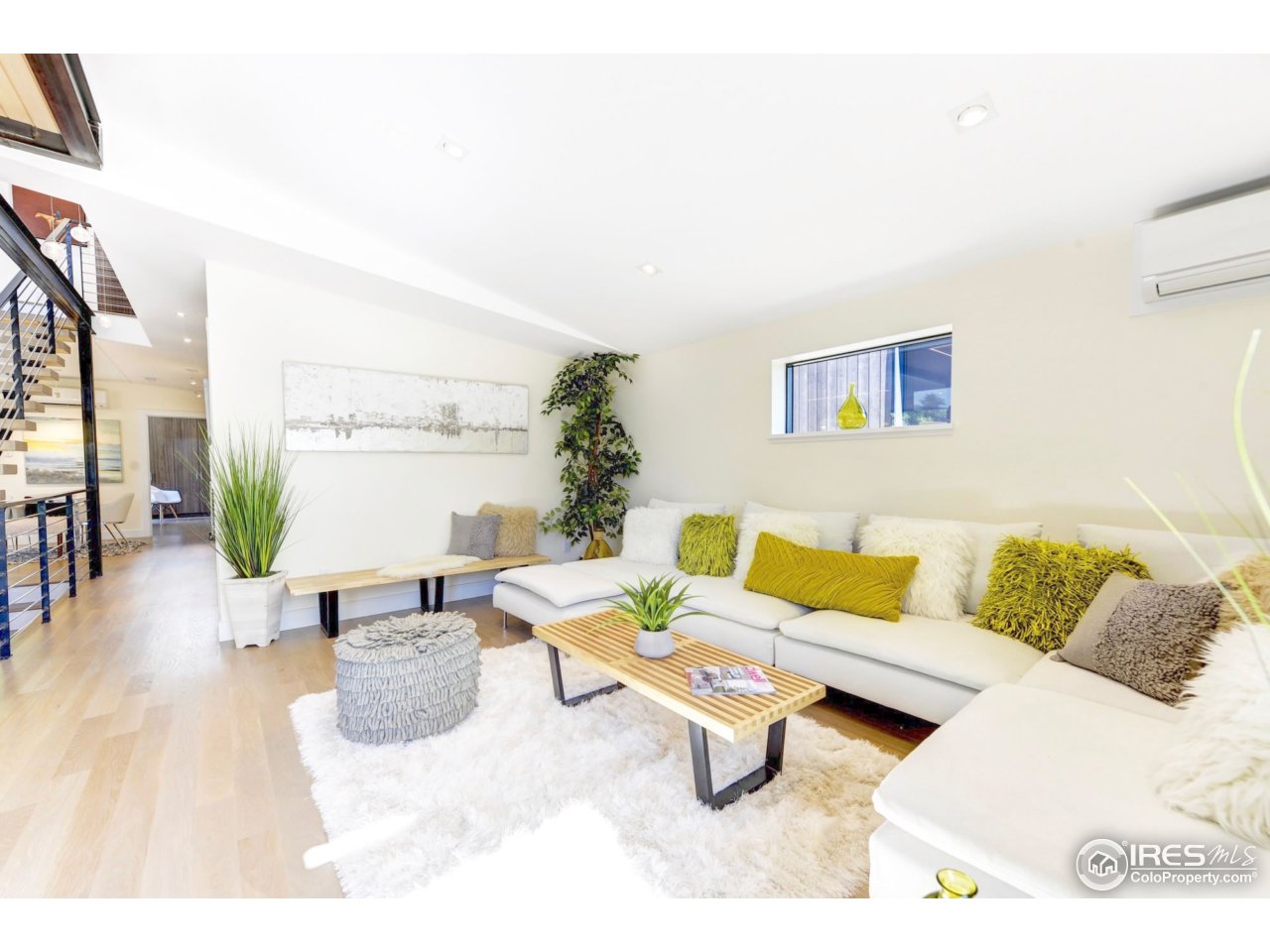2725 6th Street Boulder, CO 80304 - Photo 15 of 40 a living room with furniture and a rug