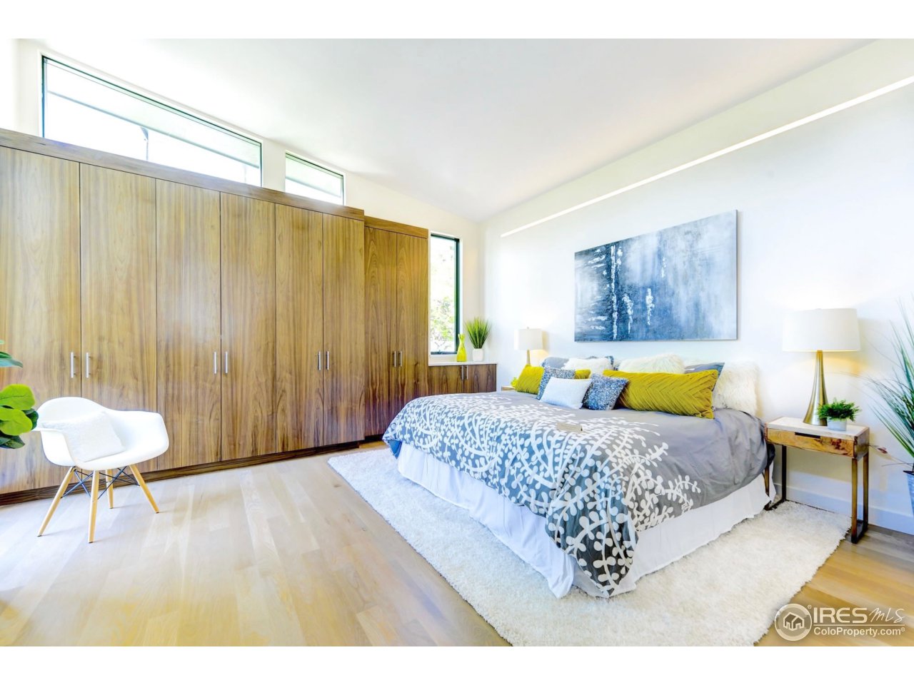 2725 6th Street Boulder, CO 80304 - Photo 16 of 40 a spacious bedroom with a bed a table and chair