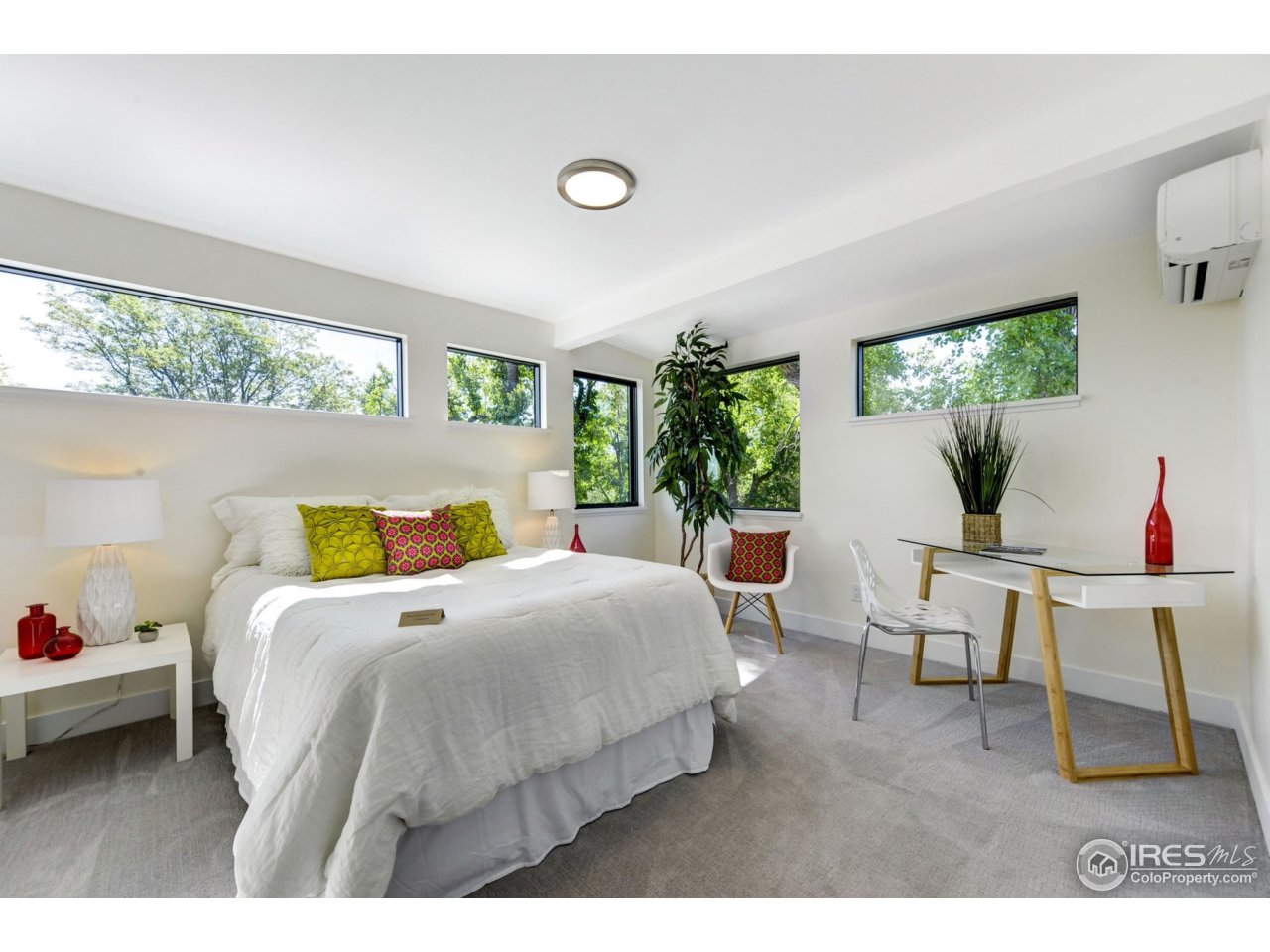 2725 6th Street Boulder, CO 80304 - Photo 20 of 40 a bedroom with a bed and large windows