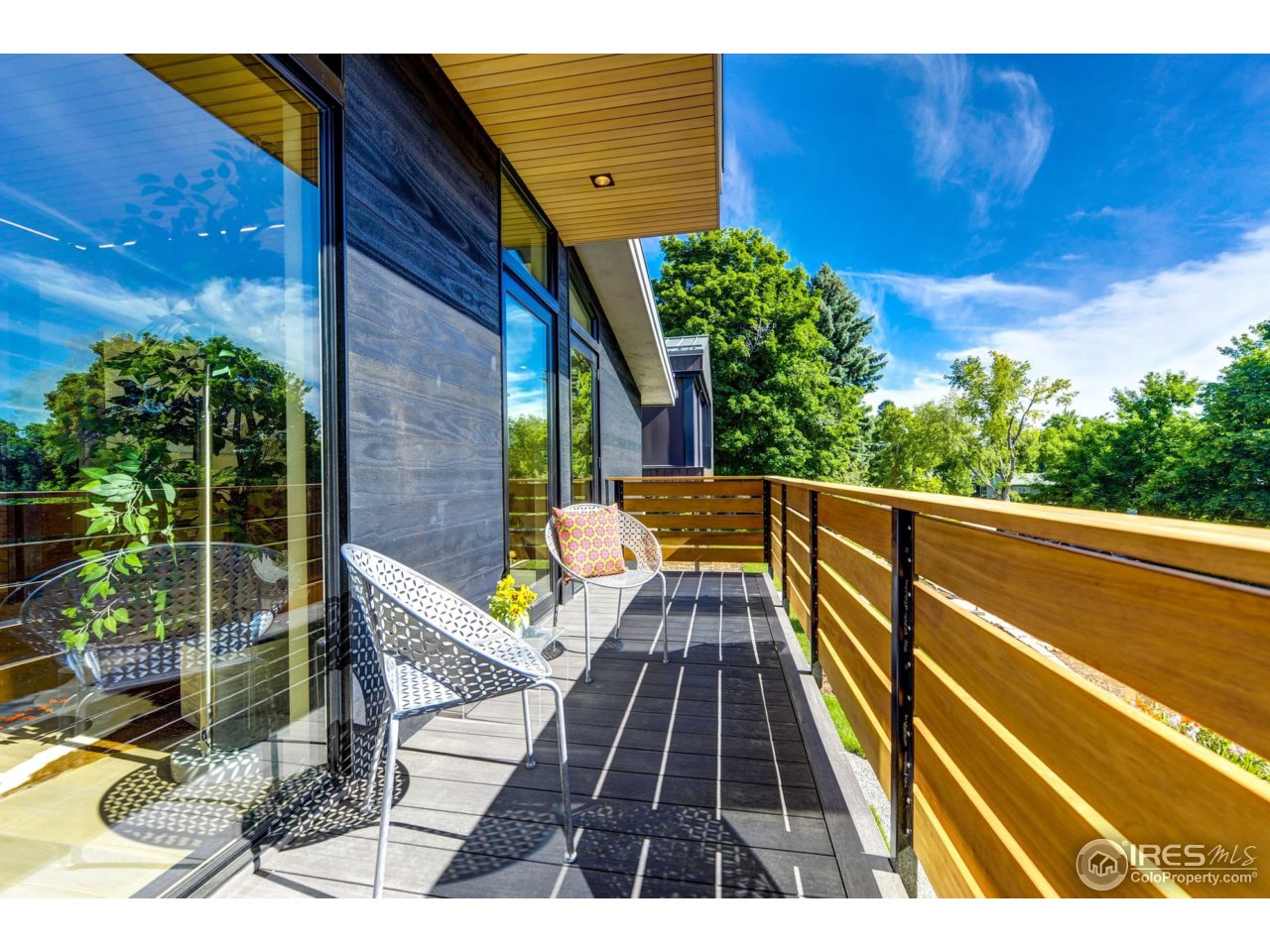 2725 6th Street Boulder, CO 80304 - Photo 25 of 40 a view of balcony with wooden floor and outdoor seating