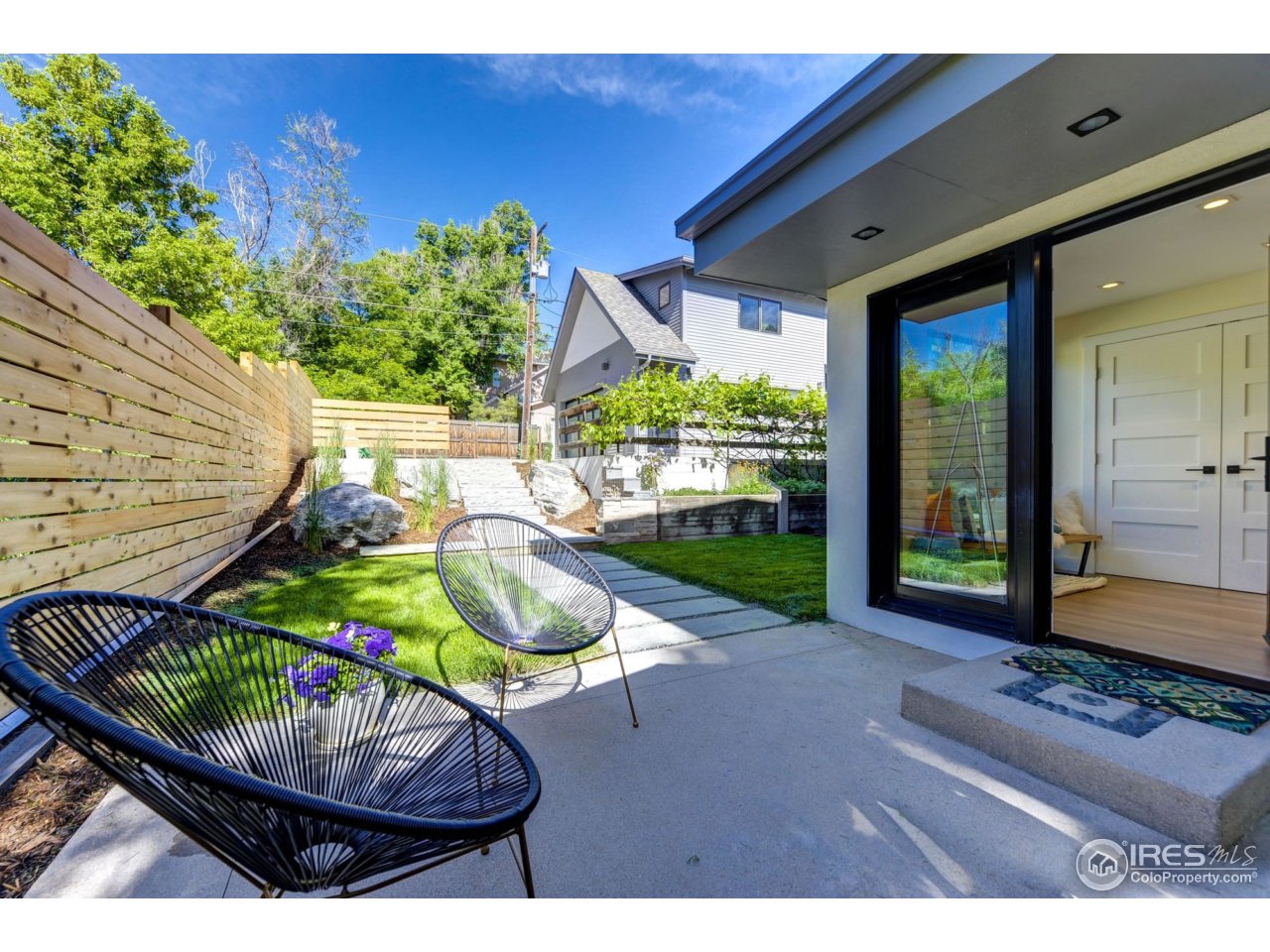2725 6th Street Boulder, CO 80304 - Photo 28 of 40 a house view with a seating space and garden view