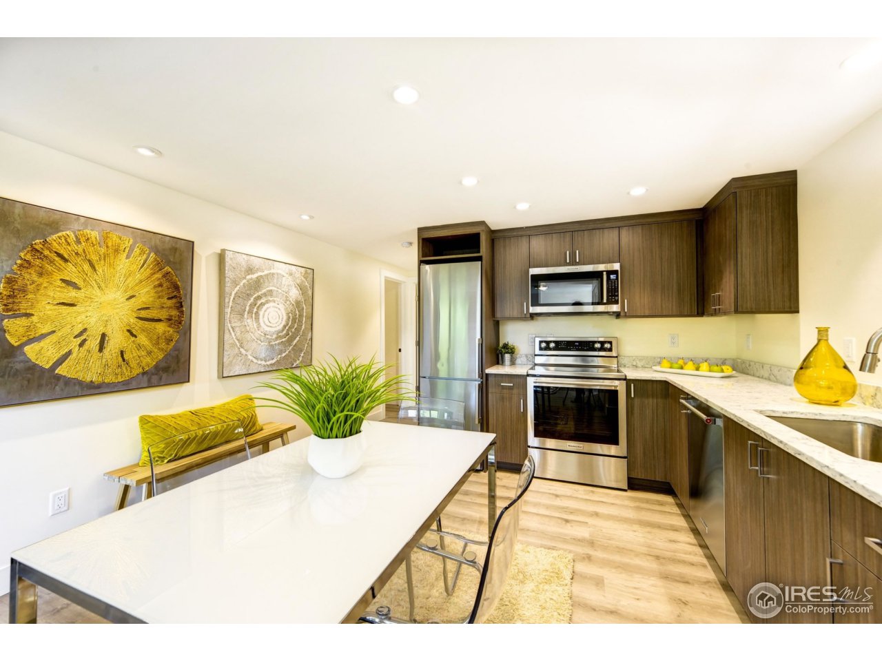 2725 6th Street Boulder, CO 80304 - Photo 33 of 40 a kitchen with stainless steel appliances kitchen island granite countertop a stove a sink and a microwave