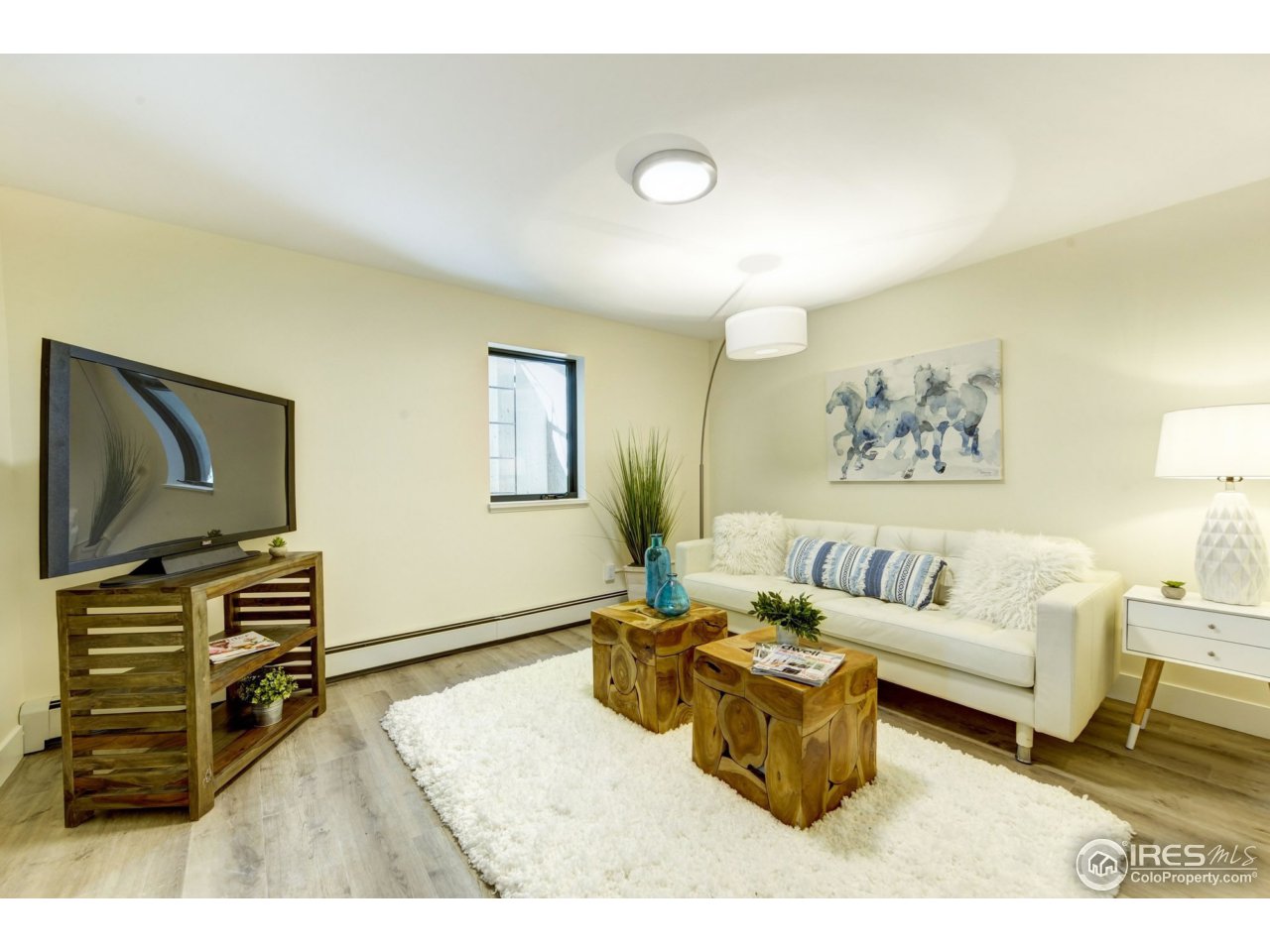 2725 6th Street Boulder, CO 80304 - Photo 36 of 40 a living room with furniture and a flat screen tv