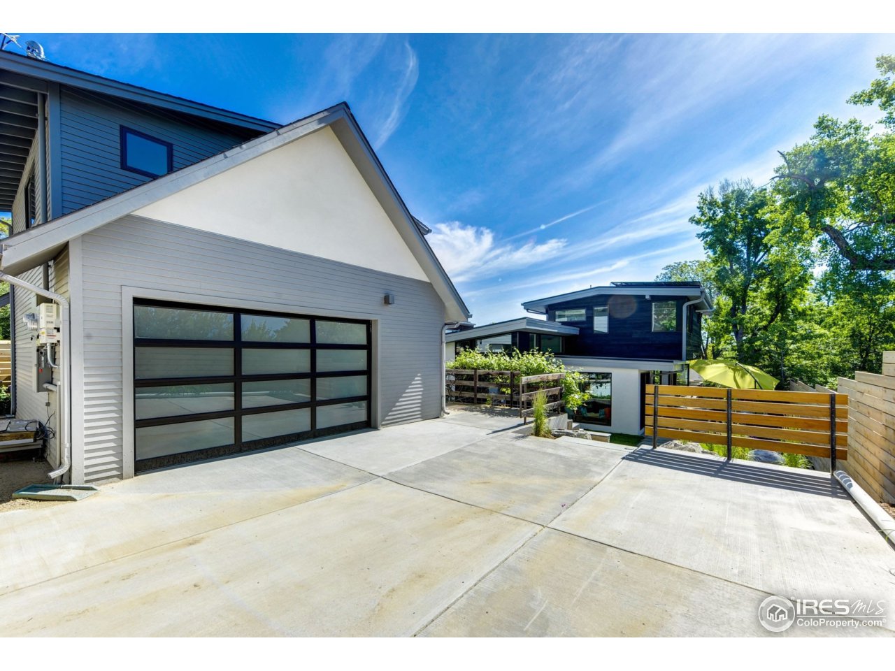 2725 6th Street Boulder, CO 80304 - Photo 39 of 40 a view of a house with a outdoor space and a car parking area