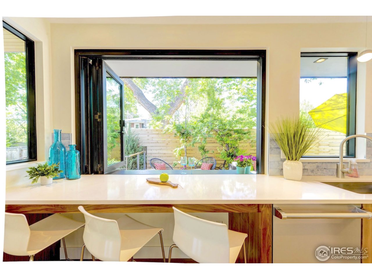 2725 6th Street Boulder, CO 80304 - Photo 7 of 40 a living room with a table and a large window