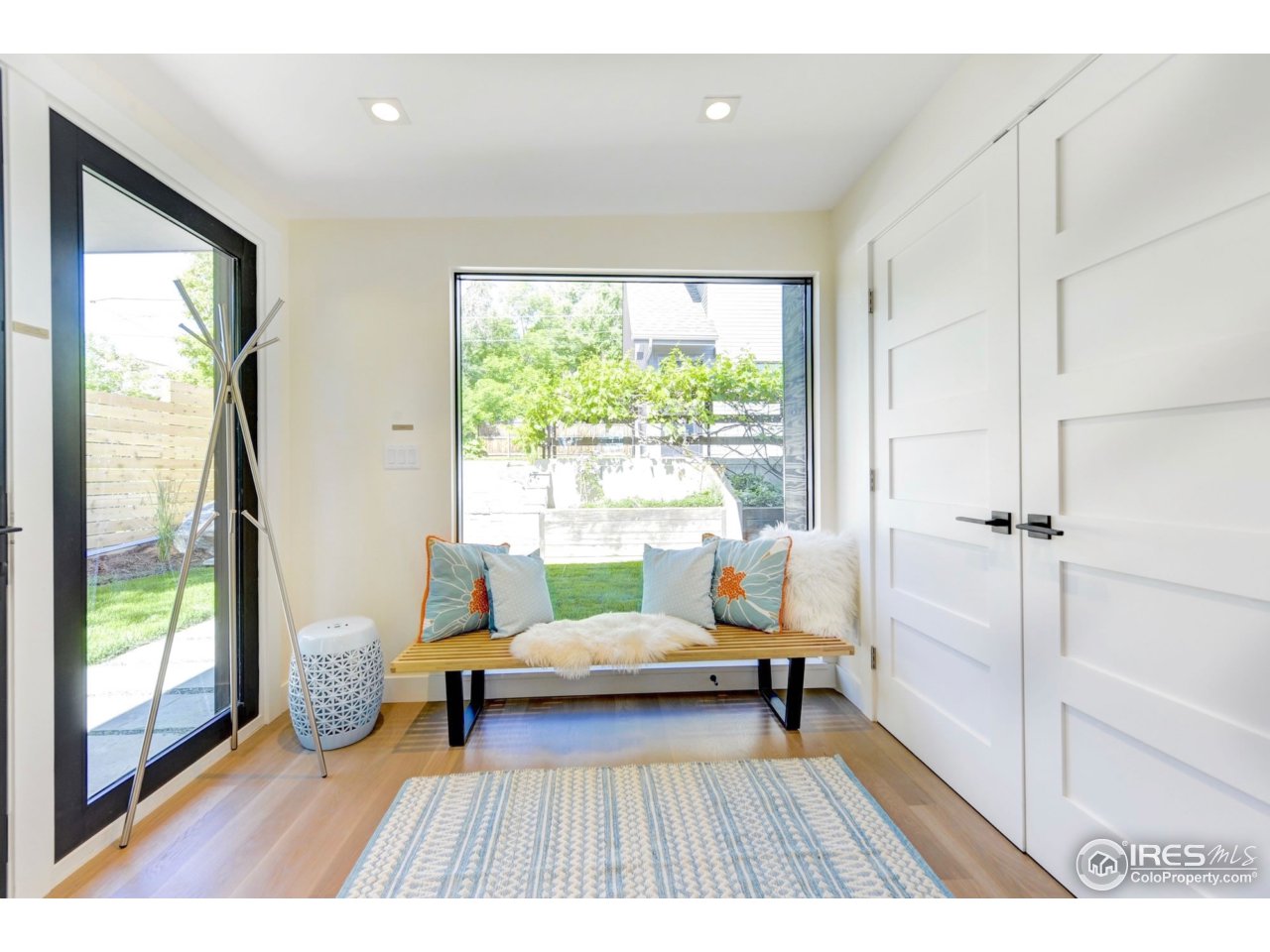 2725 6th Street Boulder, CO 80304 - Photo 10 of 40 a living room with a couch and a large window
