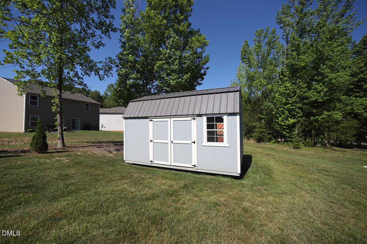 125 Mae Court Roxboro, NC 27573 - Photo 29 of 30 front view of a house with a yard