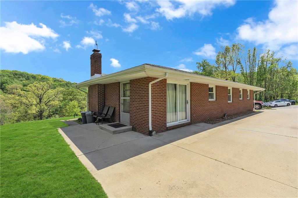 383 Ridgemont Drive Midland, PA 15059 - Photo 3 of 44 a view of a house with a yard