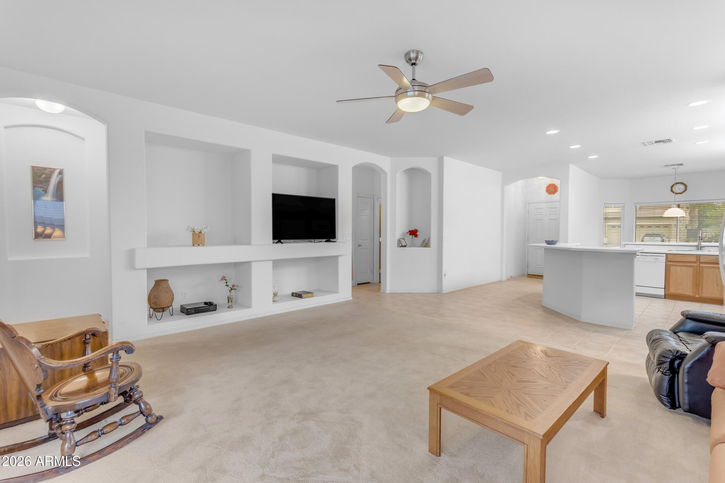 3724 East Derringer Way Gilbert, AZ 85297 - Photo 9 of 45 a living room with furniture and a flat screen tv