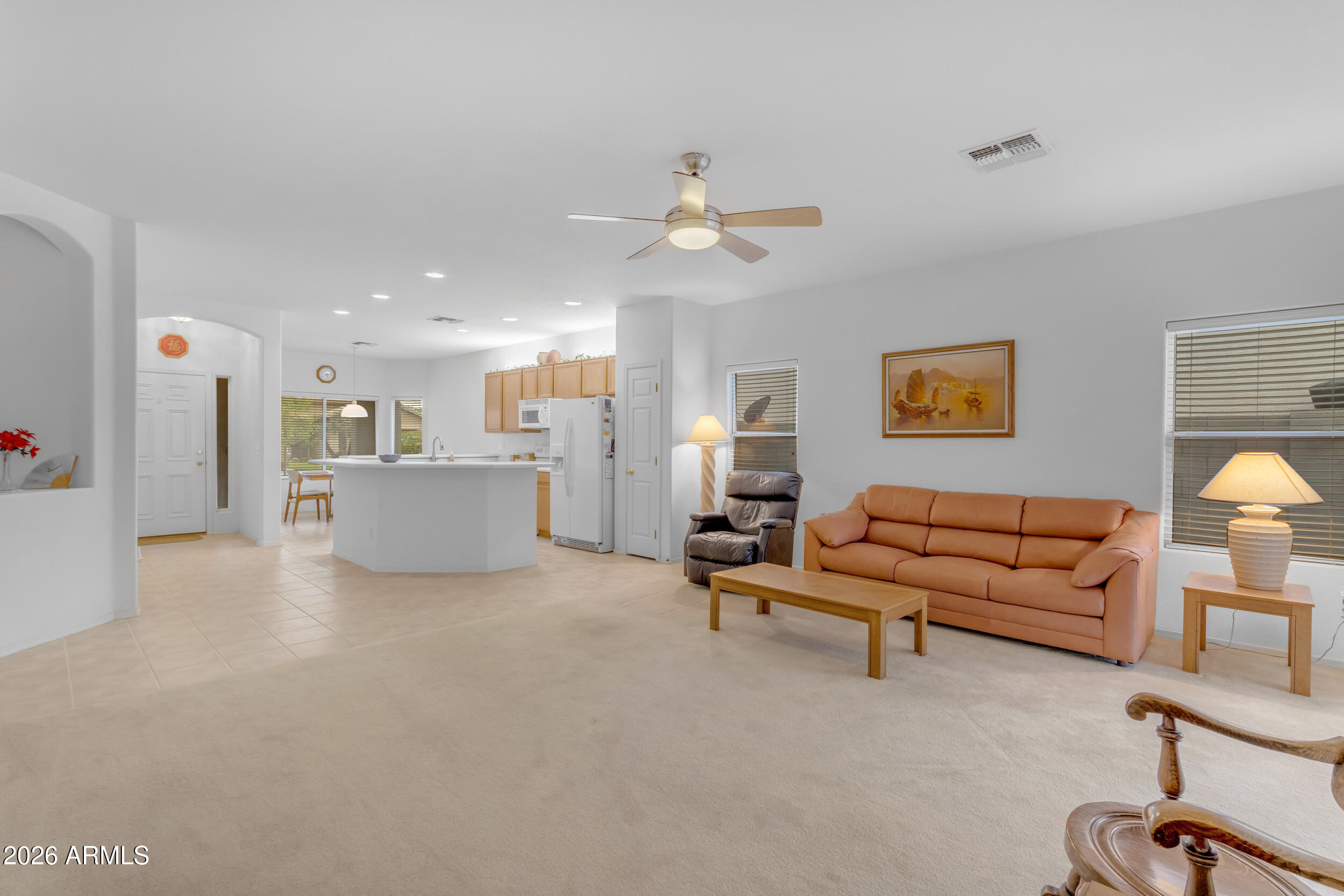 3724 East Derringer Way Gilbert, AZ 85297 - Photo 10 of 45 a living room with furniture and a ceiling fan