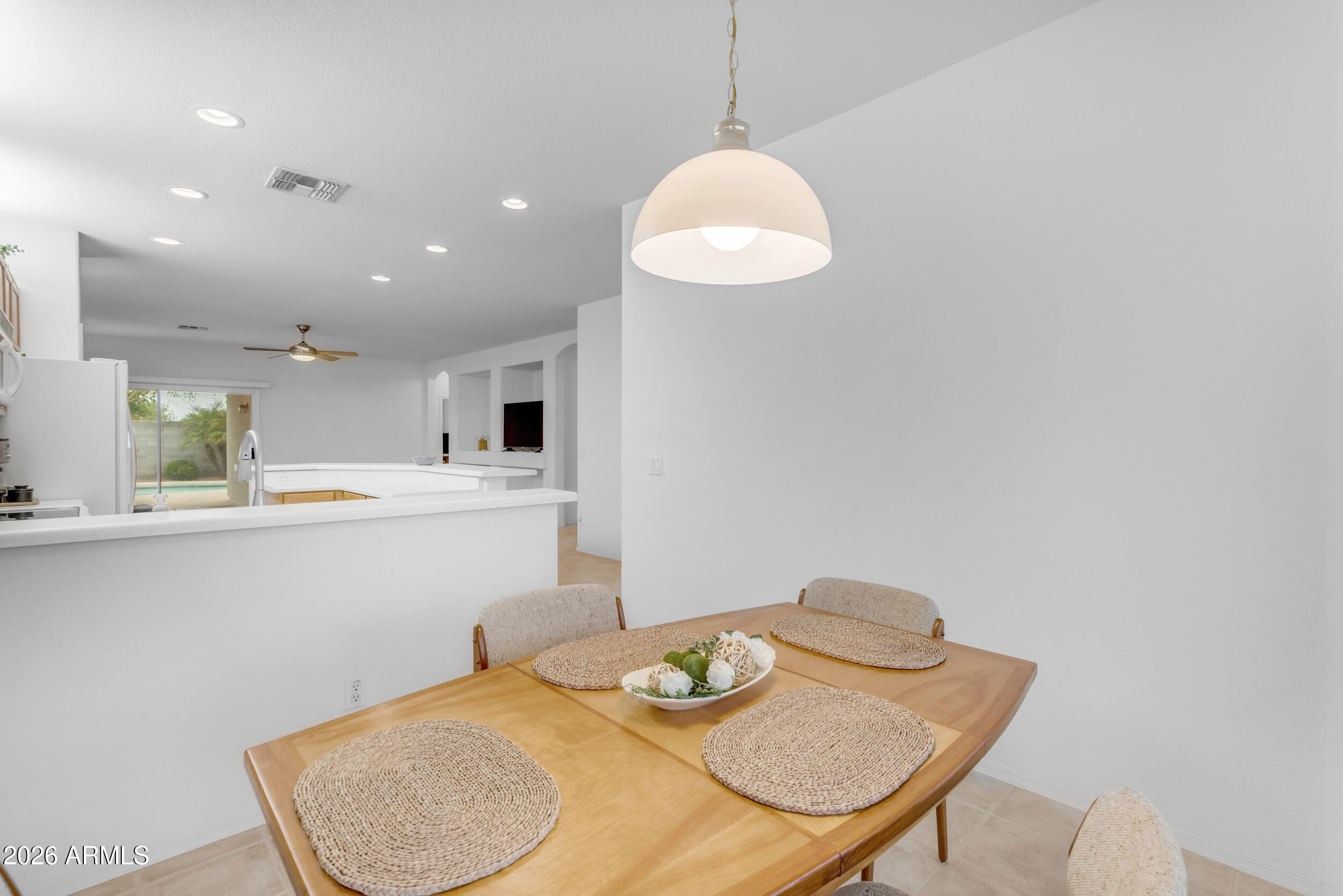 3724 East Derringer Way Gilbert, AZ 85297 - Photo 13 of 45 a kitchen with a table and chairs in it