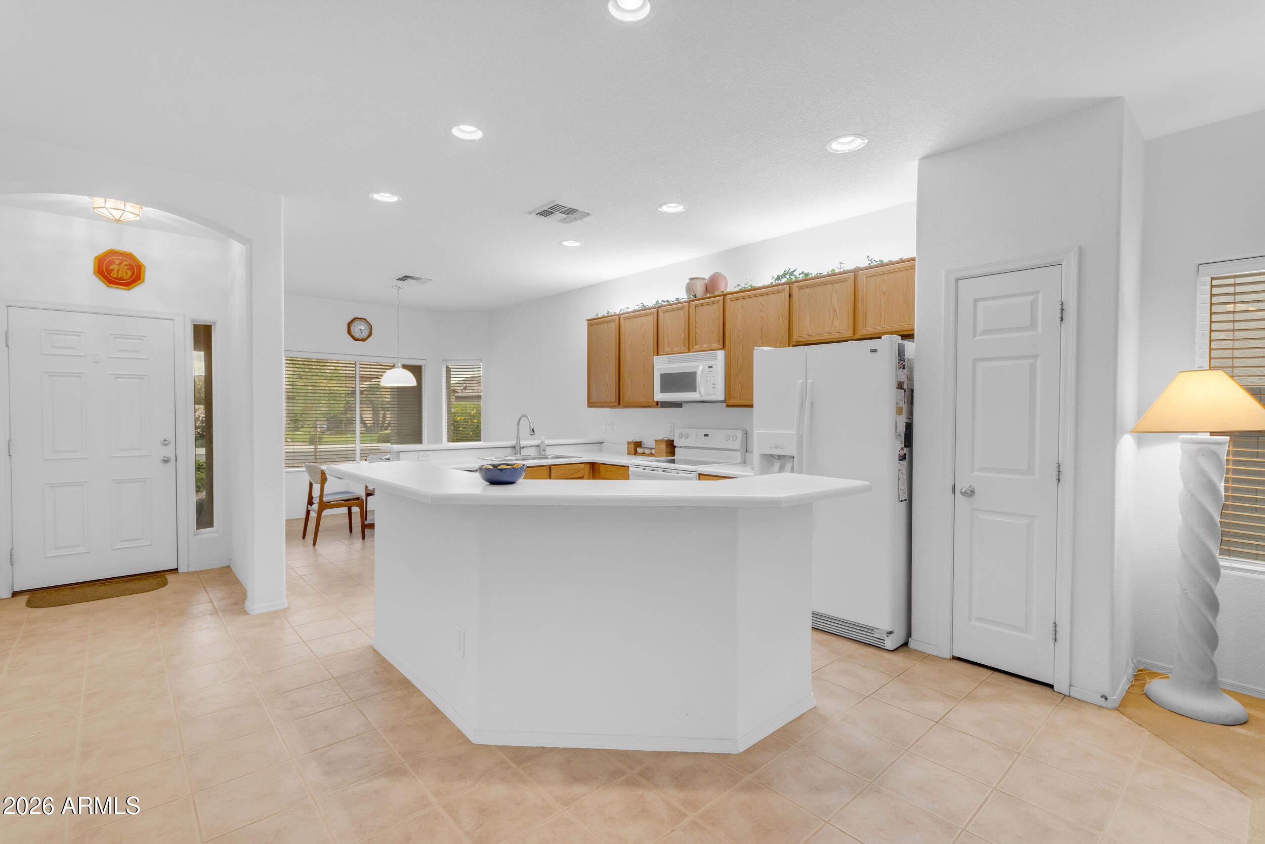 3724 East Derringer Way Gilbert, AZ 85297 - Photo 16 of 45 a kitchen with a sink a counter top space and appliances