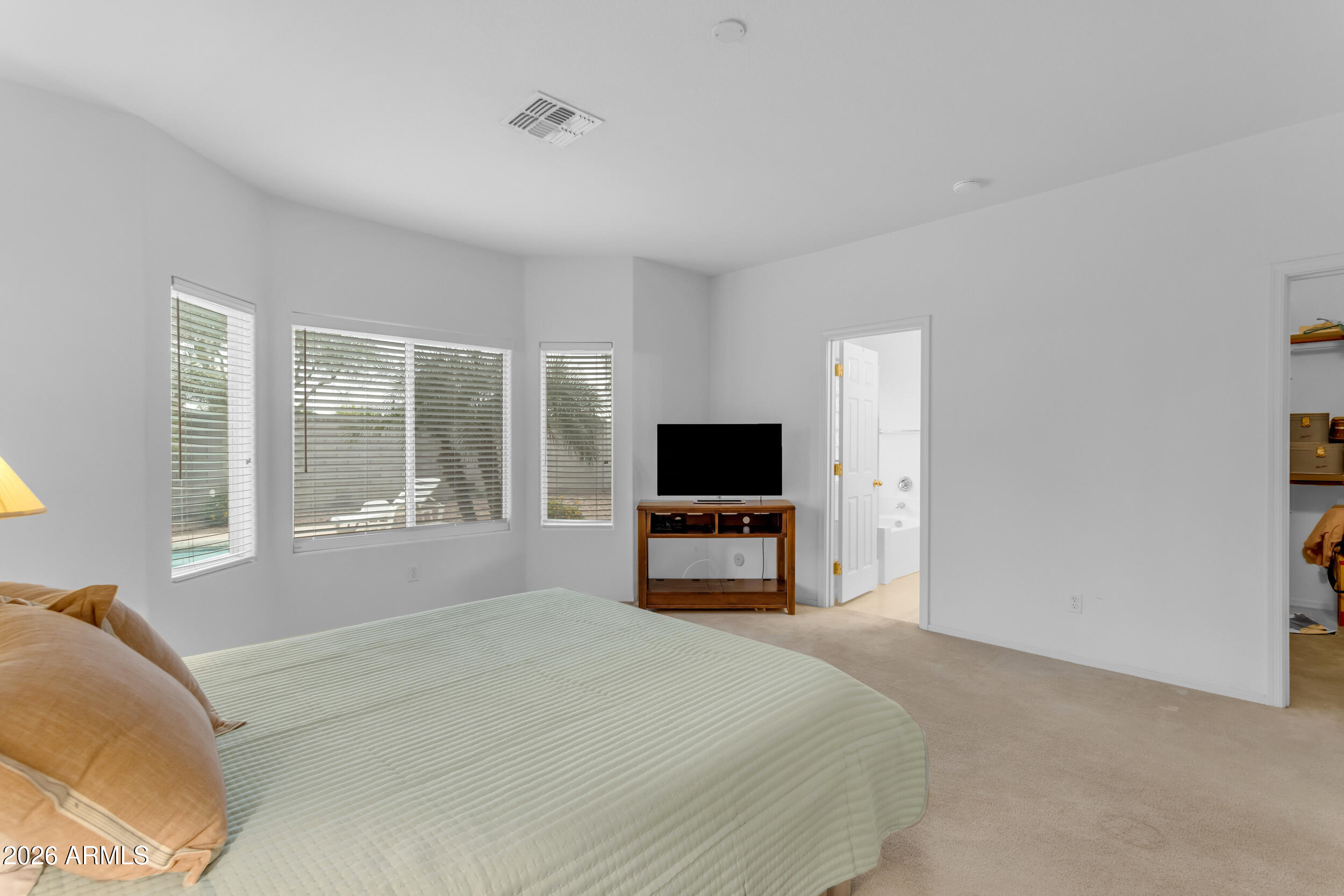 3724 East Derringer Way Gilbert, AZ 85297 - Photo 19 of 45 a bedroom with a bed and a television