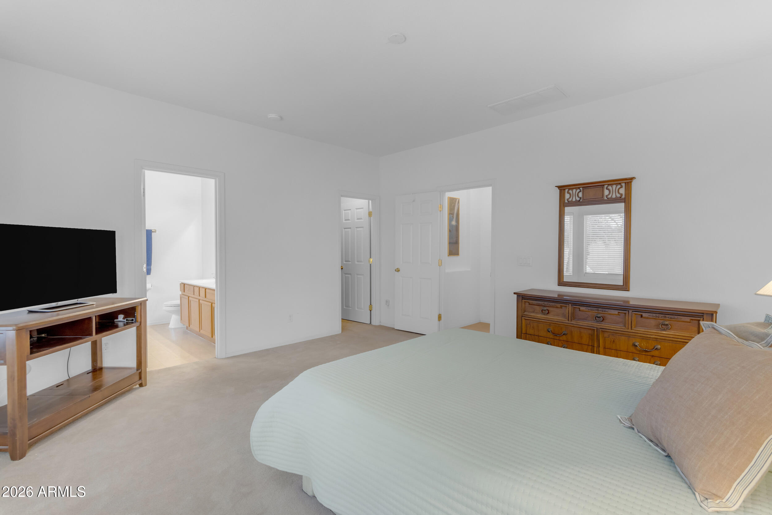 3724 East Derringer Way Gilbert, AZ 85297 - Photo 21 of 45 a bedroom with bed and flat screen tv
