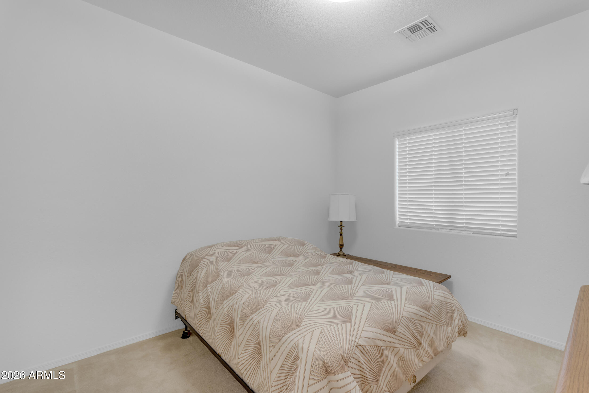 3724 East Derringer Way Gilbert, AZ 85297 - Photo 27 of 45 a view of a bedroom with a bed and a window